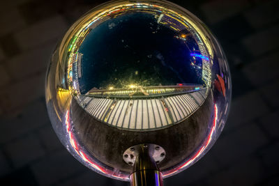 Reflection in street lamp at night