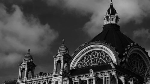 Low angle view of building against cloudy sky