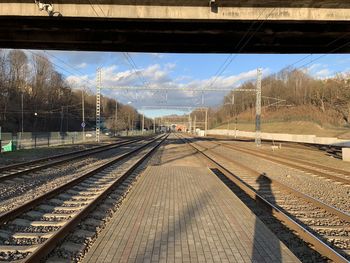 Railroad station platform against sky