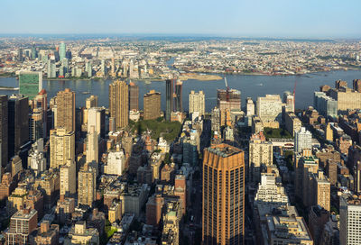 High angle view of city buildings against sky