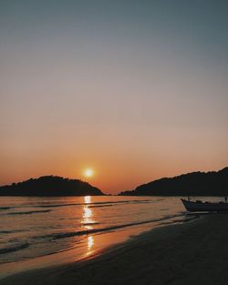 Scenic view of sea against sky at sunset