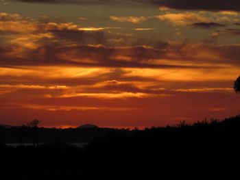 Scenic view of dramatic sky during sunset