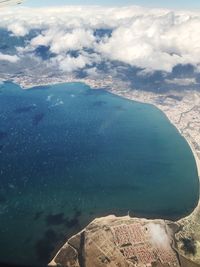 High angle view of sea against cloudy sky