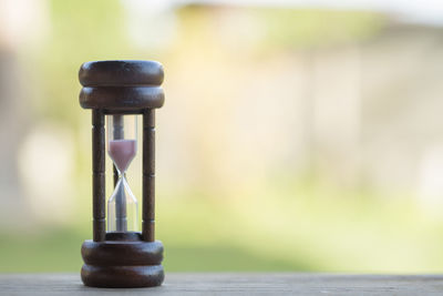 Close-up of clock on table