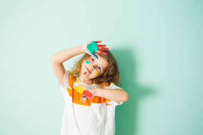 Full length of woman standing against white background