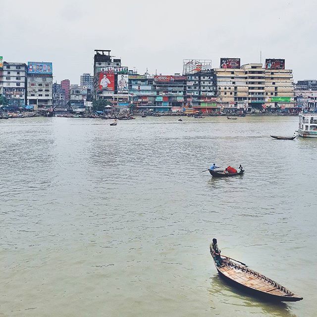 nautical vessel, water, boat, transportation, architecture, mode of transport, building exterior, built structure, waterfront, moored, river, city, travel, day, sailing, rippled, incidental people, outdoors, sky, canal