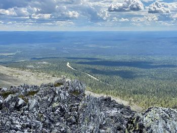 Lonely road slicing through lapland wilderness