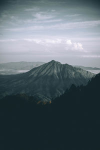 View of mountain range against cloudy sky