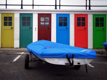 Boat against beach huts