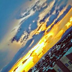 Low angle view of dramatic sky during sunset