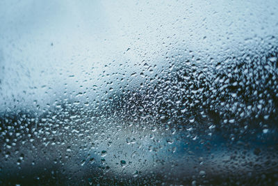 Full frame shot of wet glass window