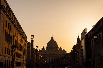 Panoramic view of buildings against sky at sunset