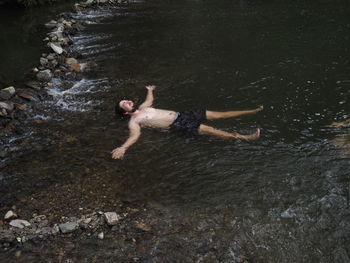 High angle view of man swimming in lake