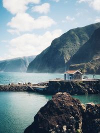 Scenic view of bay against mountains
