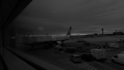 Low angle view of airplane at sunset