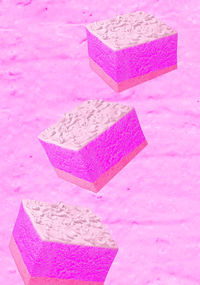 Close-up of heart shape on pink table