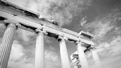 Low angle view of historical building against cloudy sky