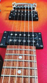 Close-up of guitar on table