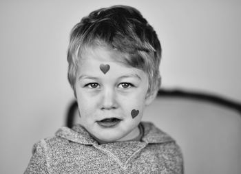 Close-up portrait of boy with face paint