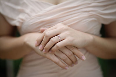 Midsection of bride with ring