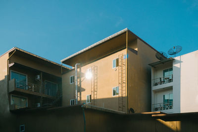 Low angle view of building against clear blue sky