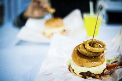 Close-up of hamburger served on table