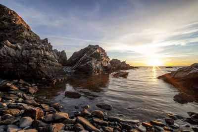 Scenic view of sea against sky during sunset