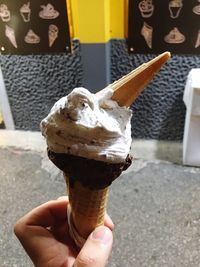 Close-up of hand holding ice cream