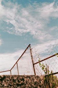 Barbed wire fence against sky