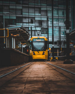 Train on railroad track in city
