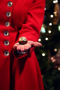 Close-up of woman with christmas lights