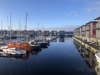 Boats moored at harbor