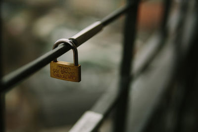 Close-up of padlock on railing