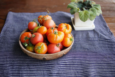 High angle view of fruits in basket on table