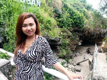 Portrait of smiling young woman outdoors