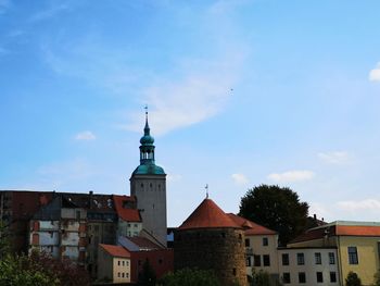 View of buildings in city against sky