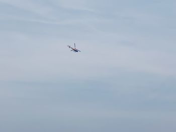 Low angle view of airplane flying in sky