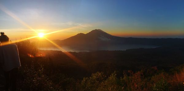 Scenic view of mountains against sky during sunset