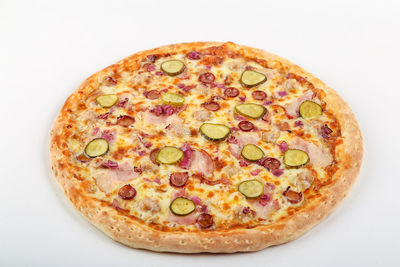 High angle view of pizza in plate against white background