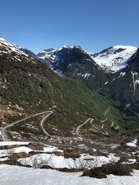 Scenic view of snowcapped mountains against clear sky