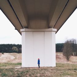 Woman standing in tunnel