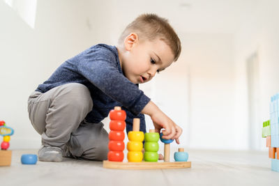 Boy playing with toys at home