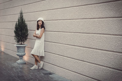 Full length of woman standing on street