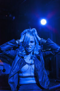 Portrait of a beautiful young woman at a nightclub