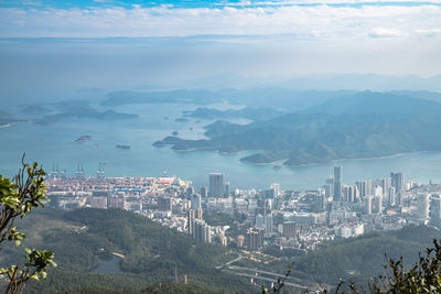 High angle view of buildings and mountains against sky