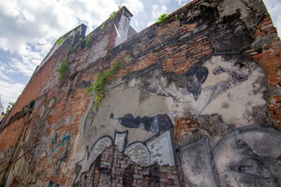 Low angle view of graffiti on building wall
