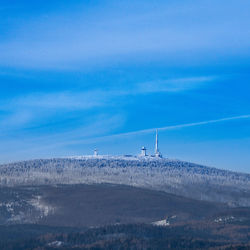 Scenic view of landscape against blue sky