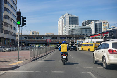 Delivering food on a moped on the city street