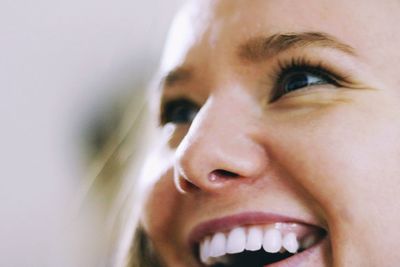 Close-up portrait of a smiling young woman