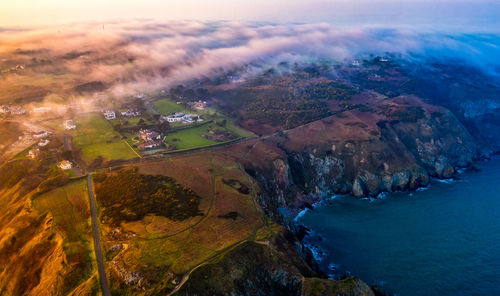 Aerial view of landscape during sunset